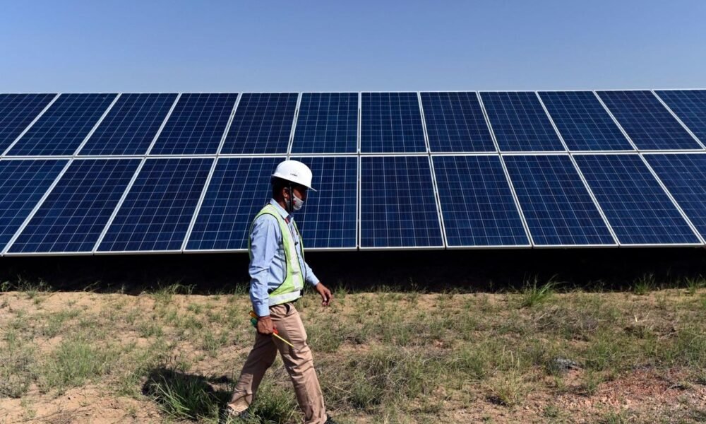 Solar panels and renewable energy infrastructure project in India.