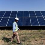 Solar panels and renewable energy infrastructure project in India.