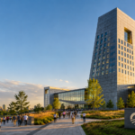 Obama Presidential Centre building in Chicago at sunset, showing a modern civic campus with landscaped public space and community-focused architecture.