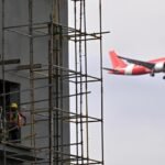 Modern airport terminal and aviation infrastructure development project in India.
