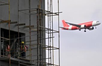 Modern airport terminal and aviation infrastructure development project in India.