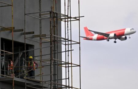 Modern airport terminal and aviation infrastructure development project in India.