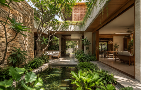 Modern luxury Indian home designed with courtyards, sandstone walls and greenery for climate-responsive living