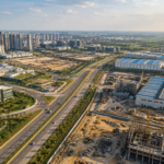 New Noida planned industrial and urban development corridor with roads, construction activity and modern buildings